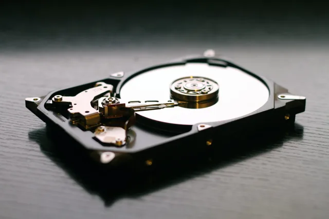 Three 24TB drives on a forensic recovery workbench