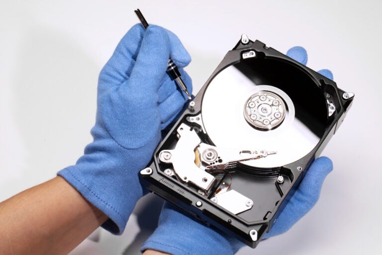 Data recovery technician working on hard drive